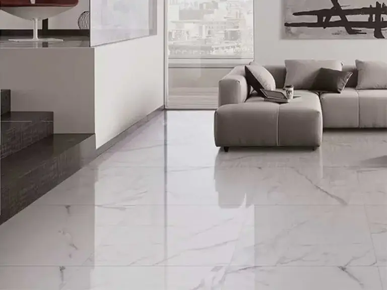 a white marble floor with a couch and a fireplace